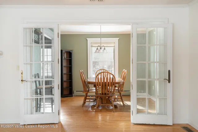 a dining room with furniture and window