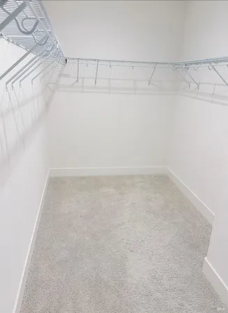 a bathroom with a sink a toilet a mirror and shower