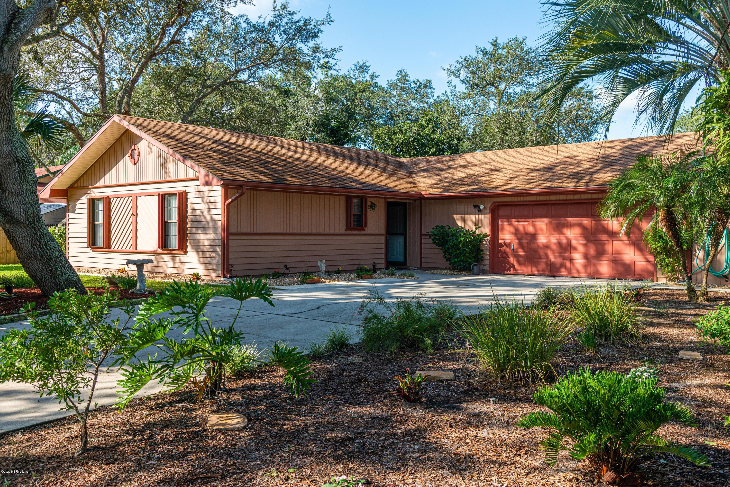 242 Jasmine Road St. Augustine, FL 32086 - Photo 1 of 26 a front view of a house with garden