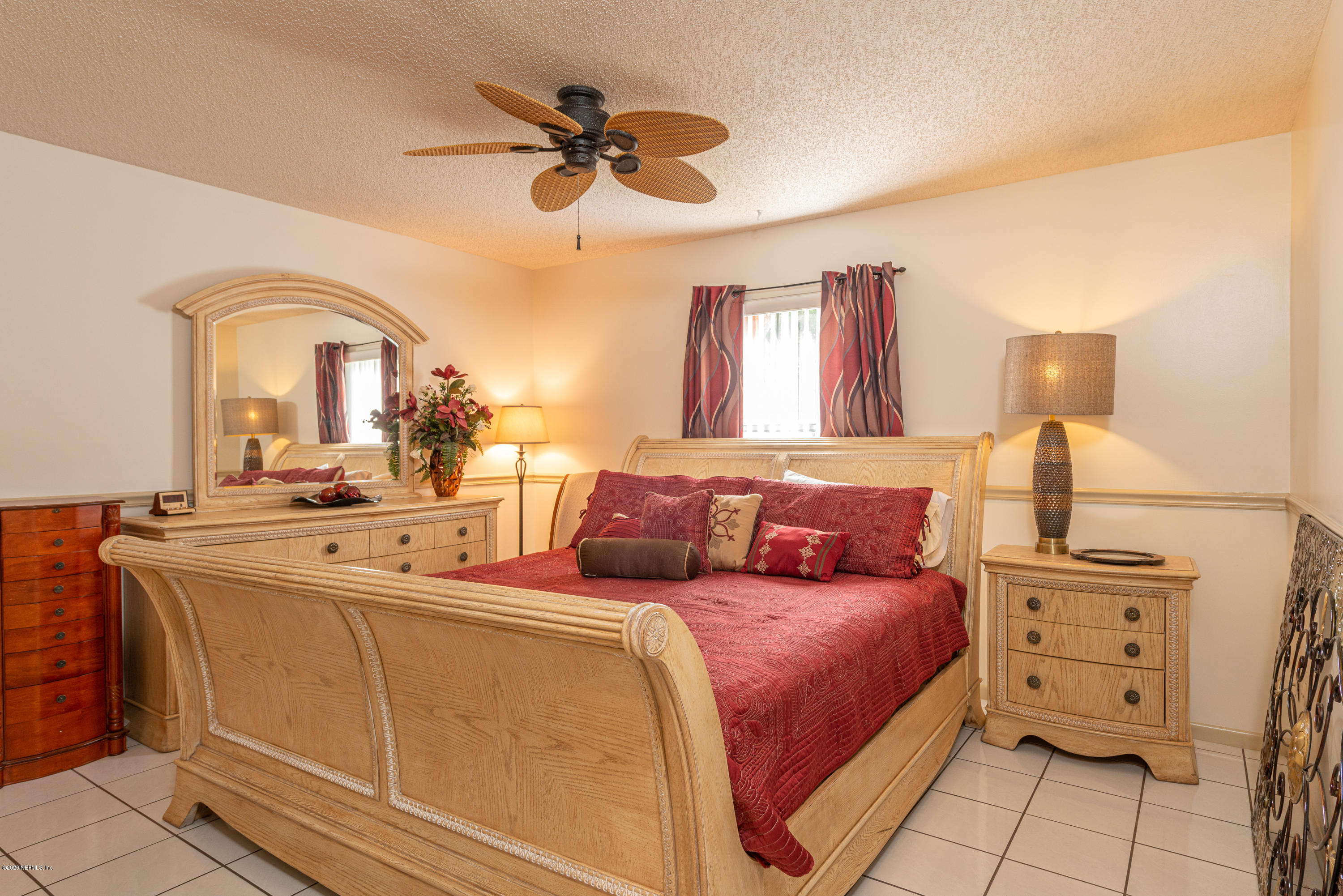 242 Jasmine Road St. Augustine, FL 32086 - Photo 11 of 26 a bedroom with a bed and a dresser