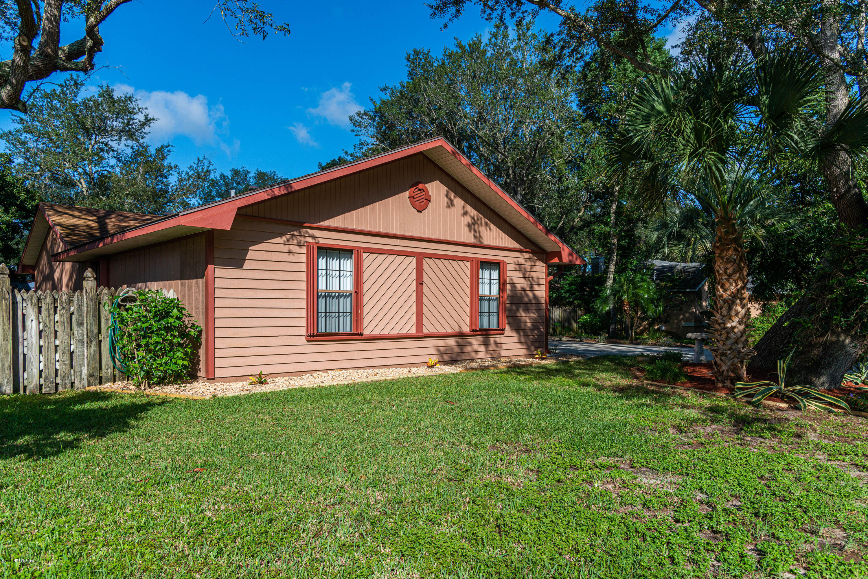 242 Jasmine Road St. Augustine, FL 32086 - Photo 19 of 26 a front view of a house with a yard and trees