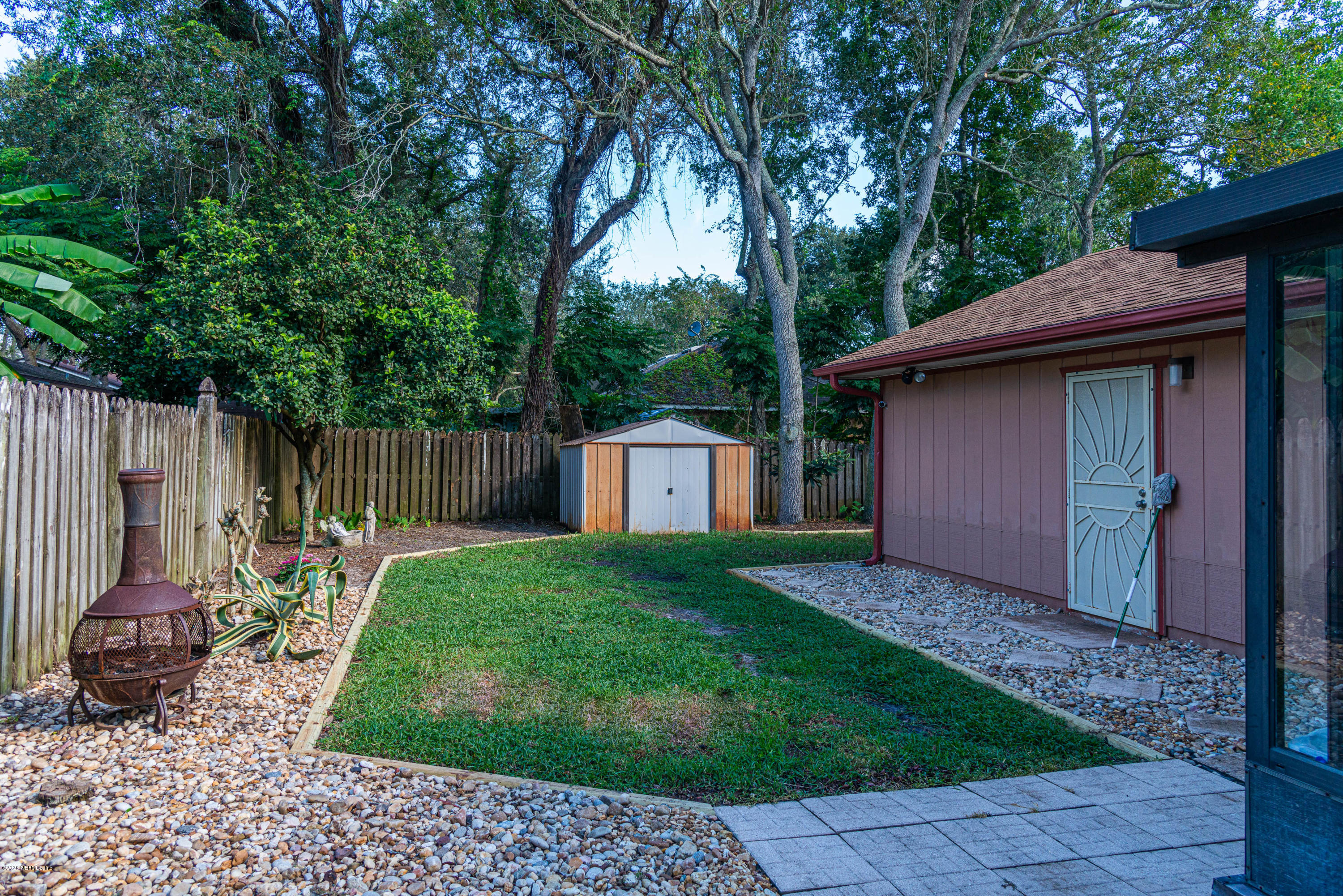 242 Jasmine Road St. Augustine, FL 32086 - Photo 20 of 26 a backyard of a house with table and chairs