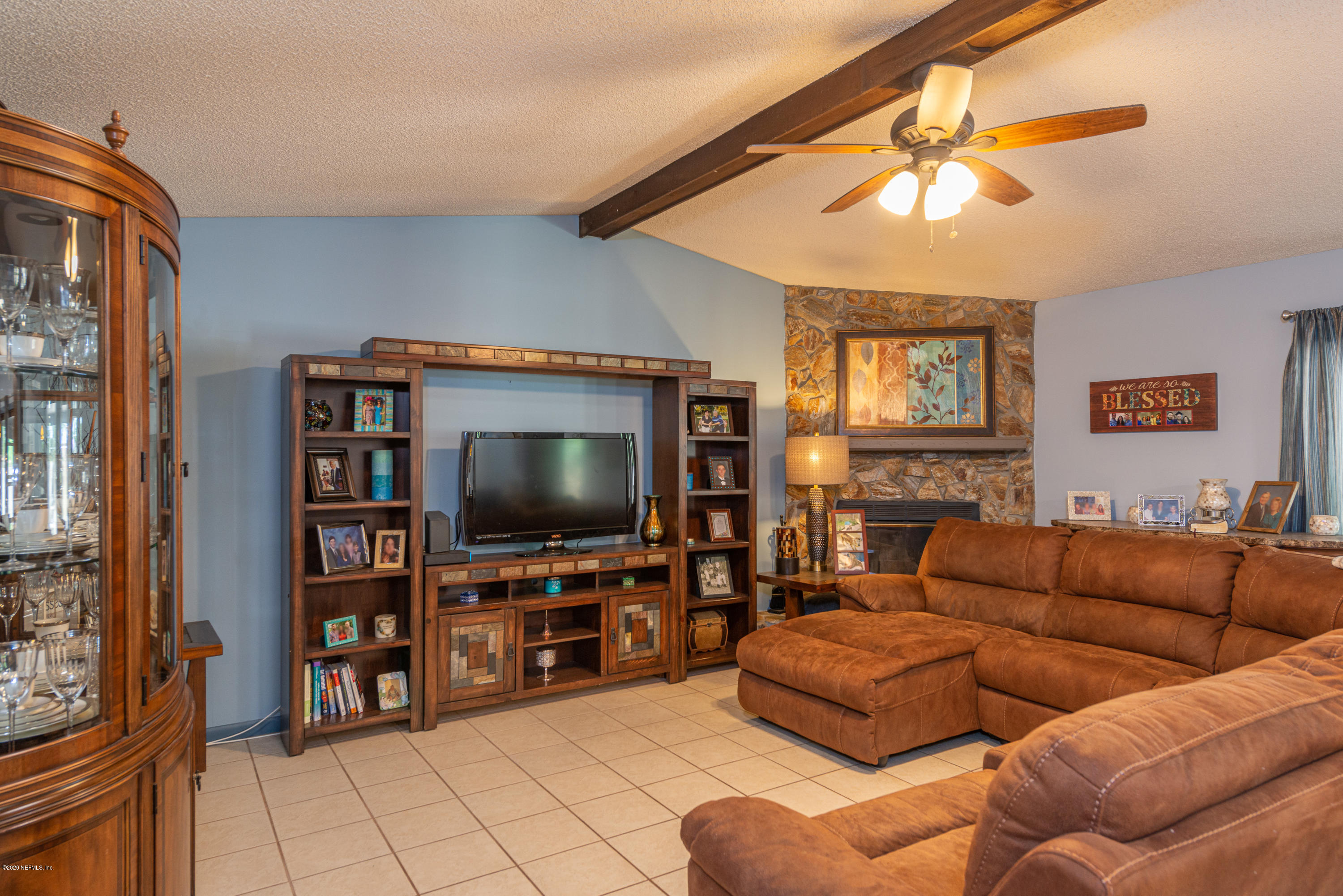 242 Jasmine Road St. Augustine, FL 32086 - Photo 5 of 26 a living room with furniture and a flat screen tv
