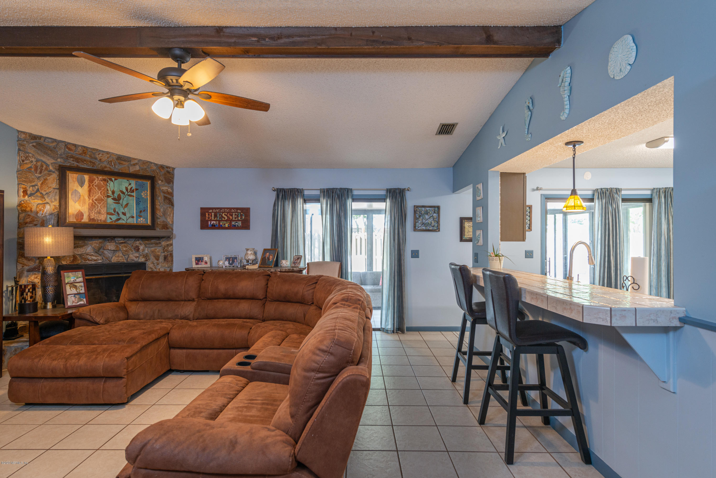 242 Jasmine Road St. Augustine, FL 32086 - Photo 6 of 26 a living room with furniture a chandelier and a window