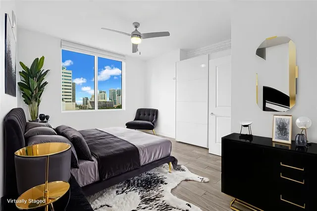 a bathroom with a bathtub a mirror a sink and vanity