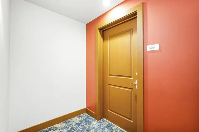 a kitchen with stainless steel appliances granite countertop a refrigerator a sink and a stove