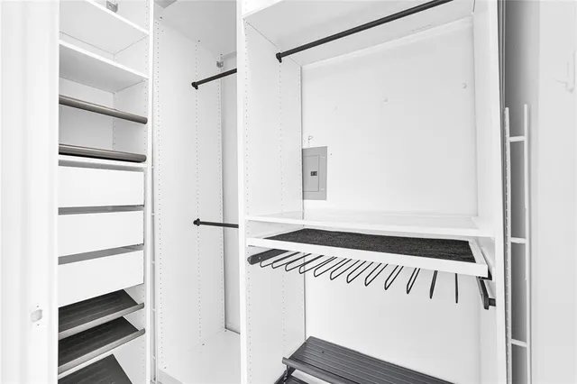 a view of a kitchen with wooden cabinet and a ceiling fan