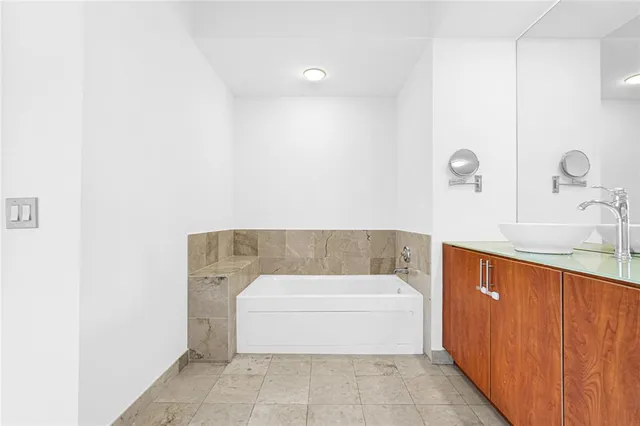 a picture of a cabinet with a white wall and white walls