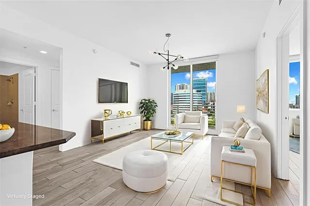 a view of a balcony with chairs and a patio