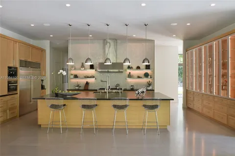 a dining room with furniture window and outside view