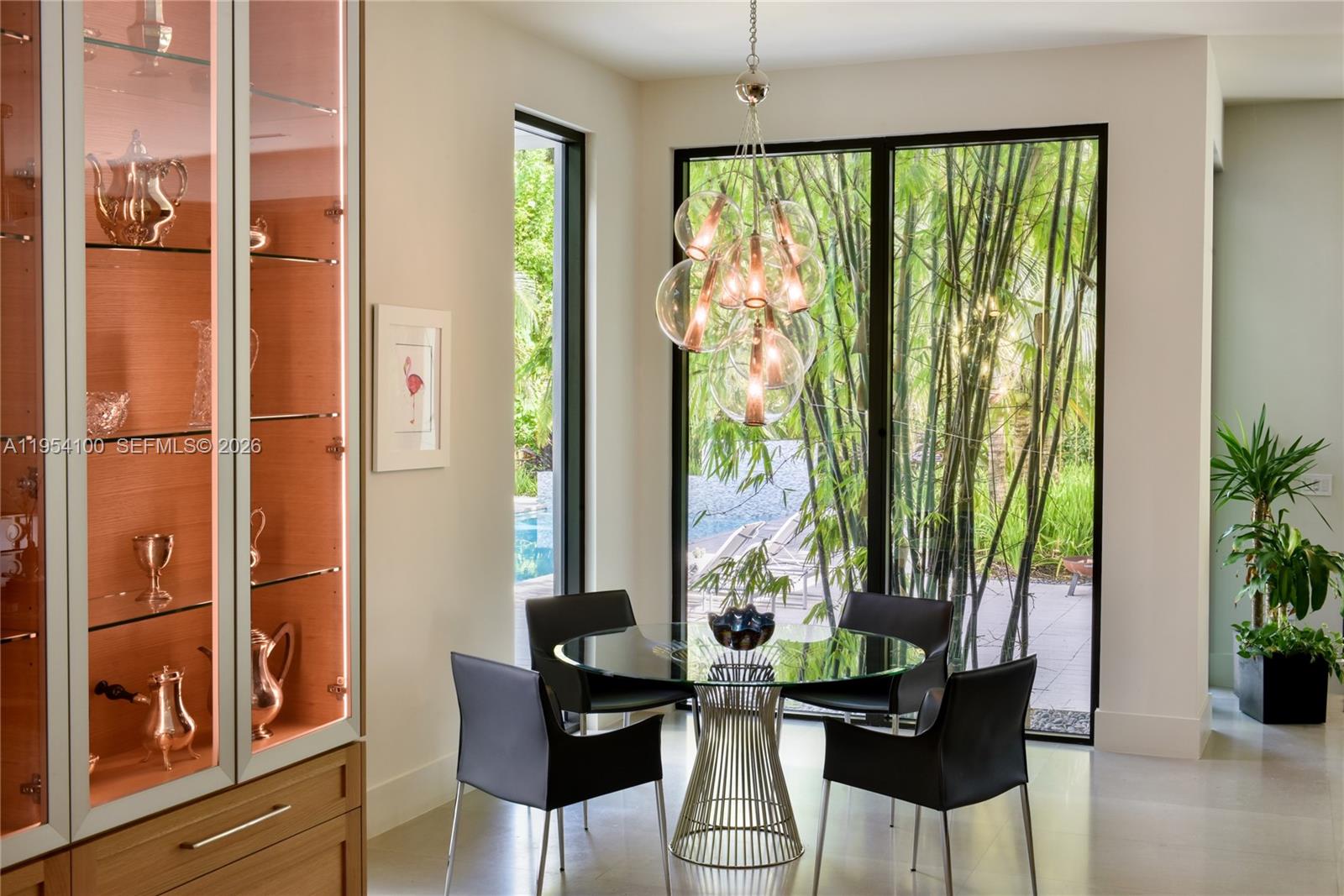 11050 Southwest 69th Avenue Pinecrest, FL 33156 - Photo 16 of 31 a dining room with furniture window and outside view