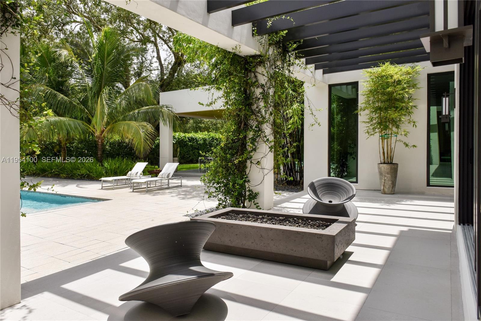 11050 Southwest 69th Avenue Pinecrest, FL 33156 - Photo 30 of 31 a outdoor space with furniture and garden view