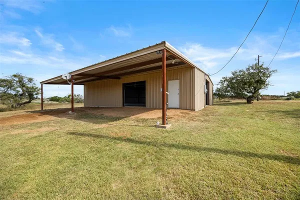 a house view with swimming pool in front of it