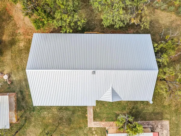a house with a trees in front of it