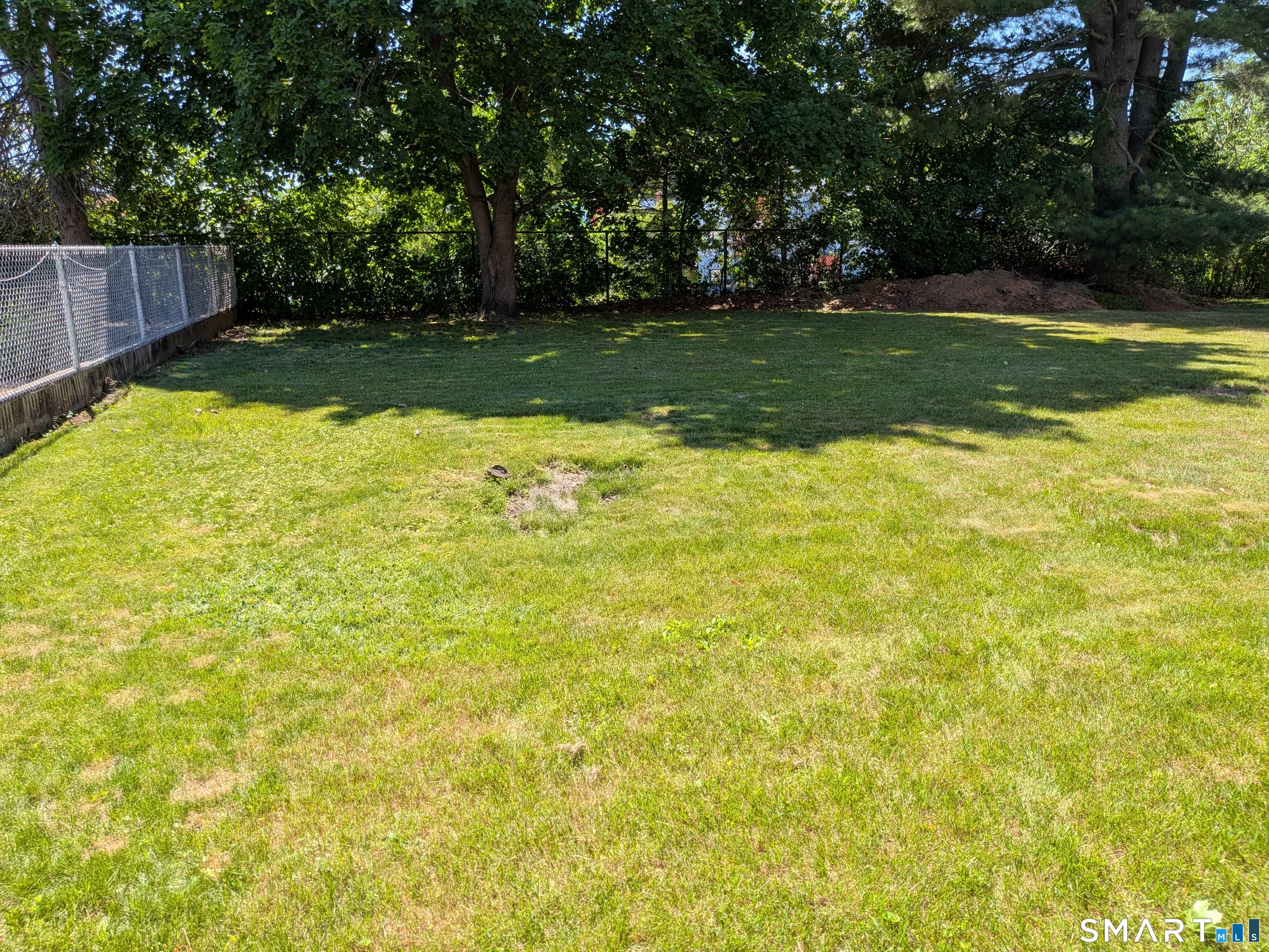 124 Spring Lake Road Waterbury, CT 06706 - Photo 31 of 34 Level, fenced and private backyard with incredible sunsets!