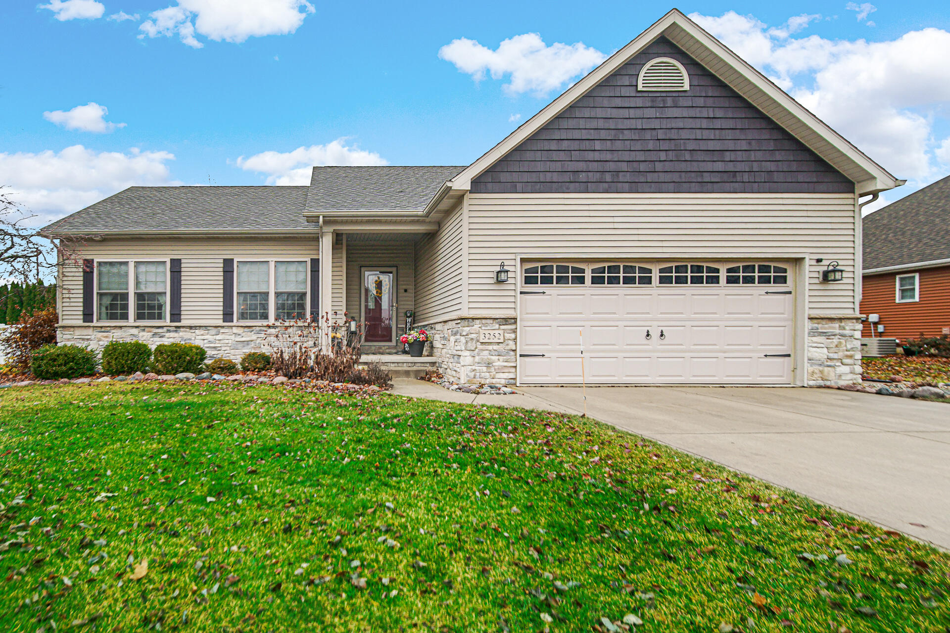 3252 Mockingbird Lane Valparaiso, IN 46383 - Photo 1 of 23 a front view of a house with a yard and potted plants
