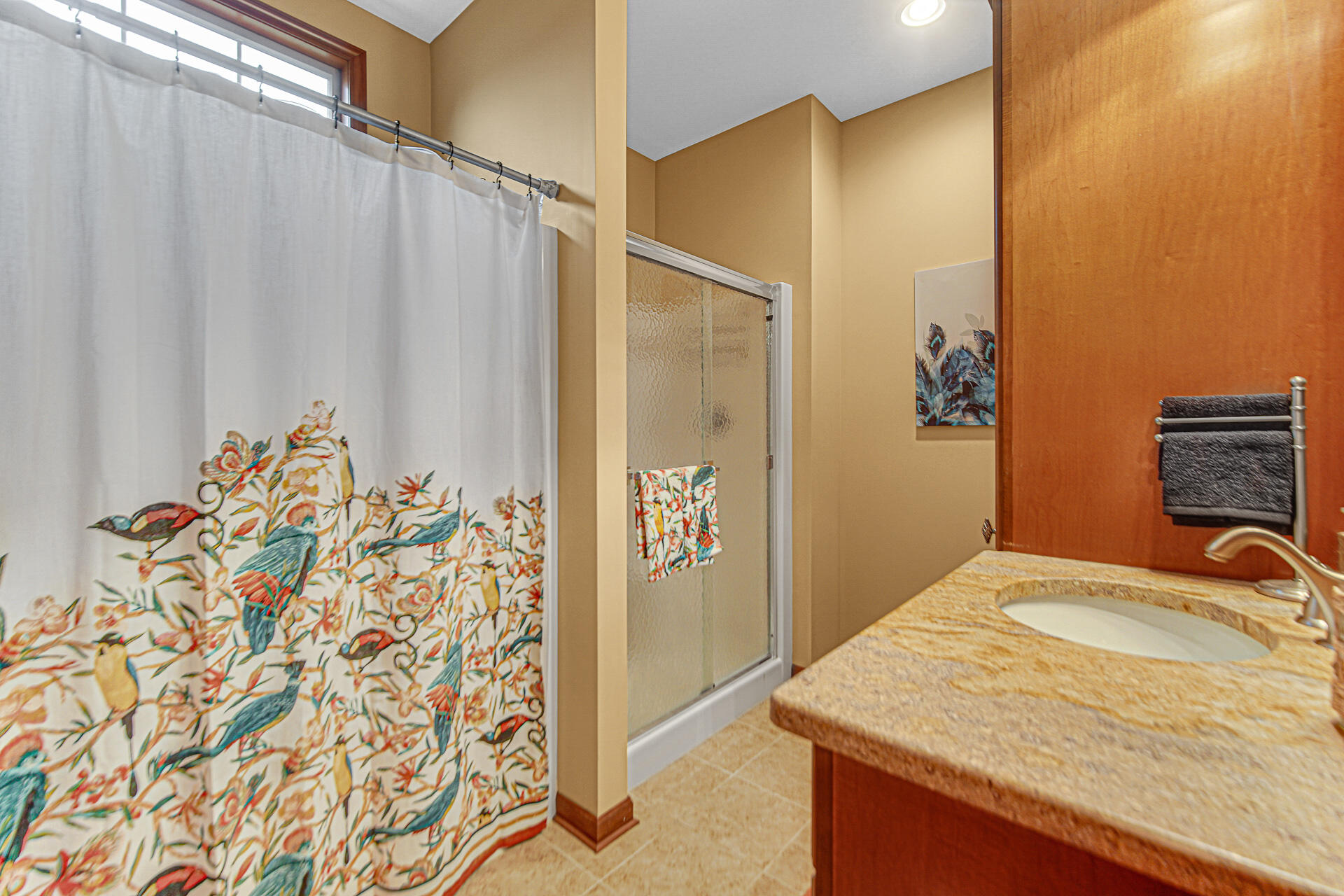3252 Mockingbird Lane Valparaiso, IN 46383 - Photo 15 of 23 a bathroom with a granite countertop sink and a mirror