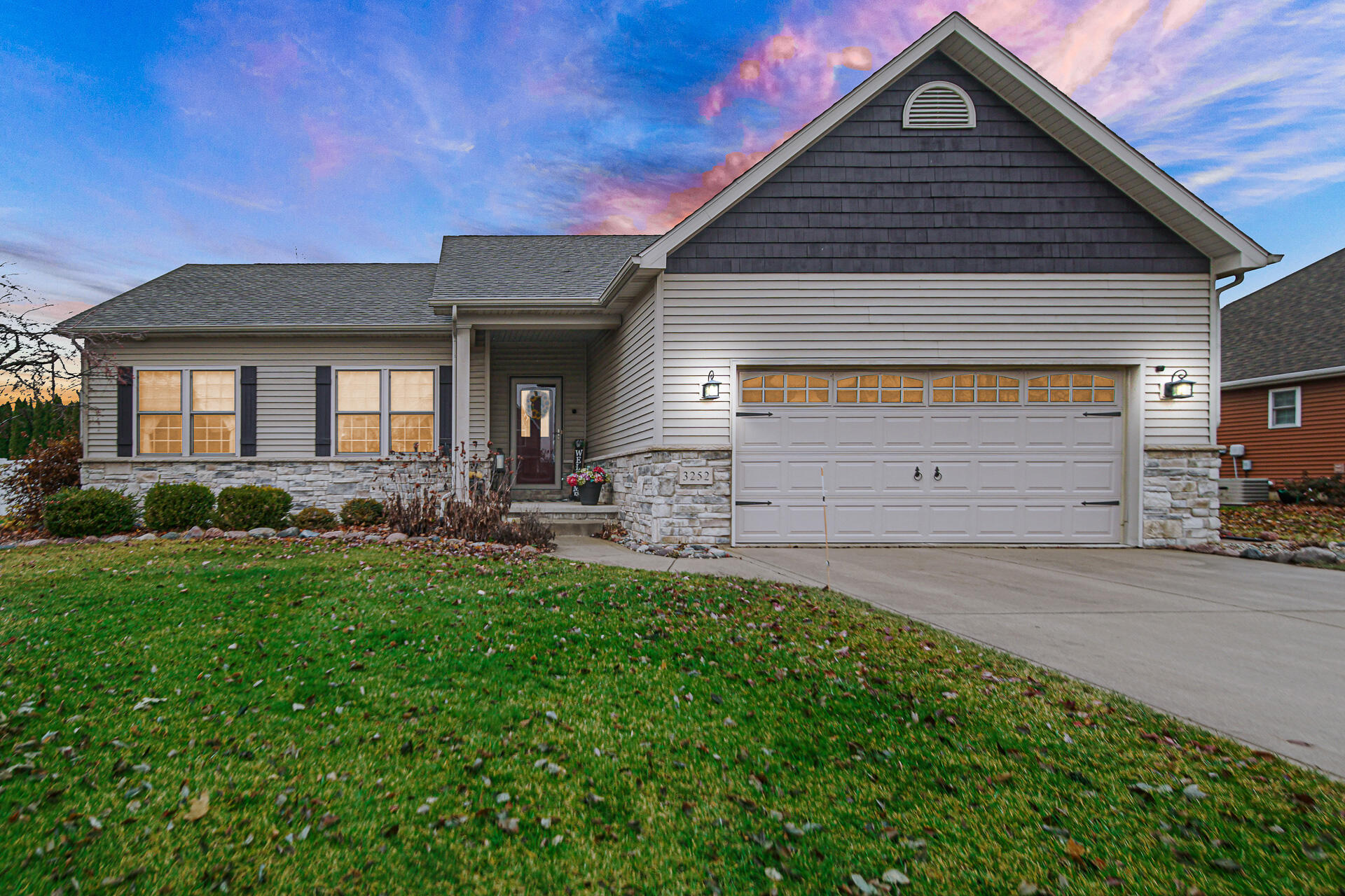 3252 Mockingbird Lane Valparaiso, IN 46383 - Photo 2 of 23 a front view of a house with a yard and garage