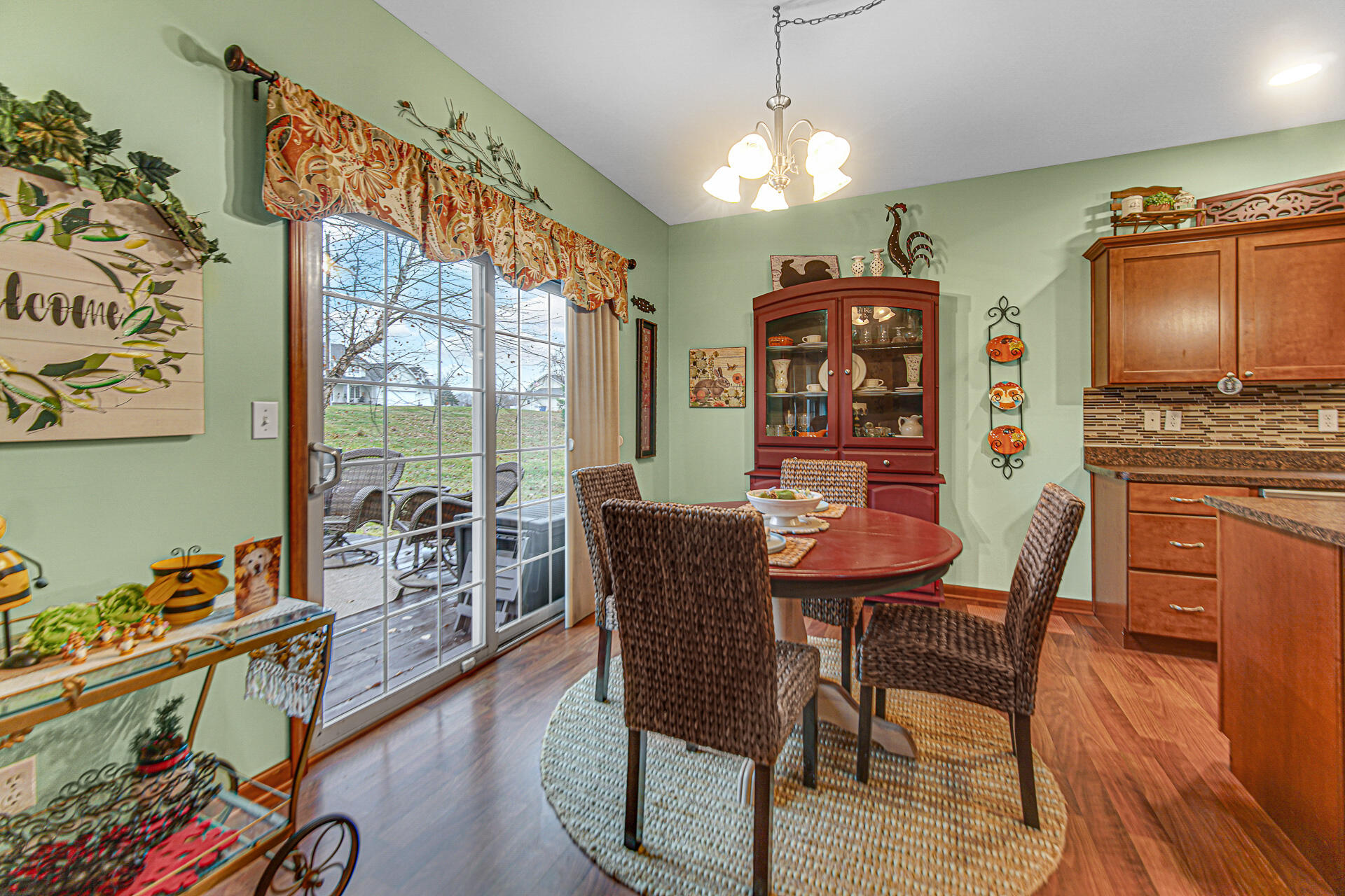 3252 Mockingbird Lane Valparaiso, IN 46383 - Photo 8 of 23 a view of a dining room with furniture a chandelier and wooden floor