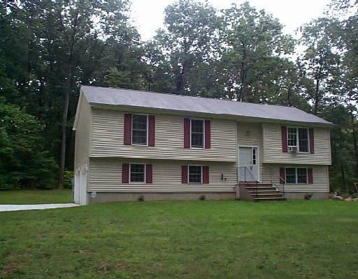 21 Manor Road, Unit 21 New Milford, CT 06776 - Photo 1 of 1 a backyard of a house with lots of green space