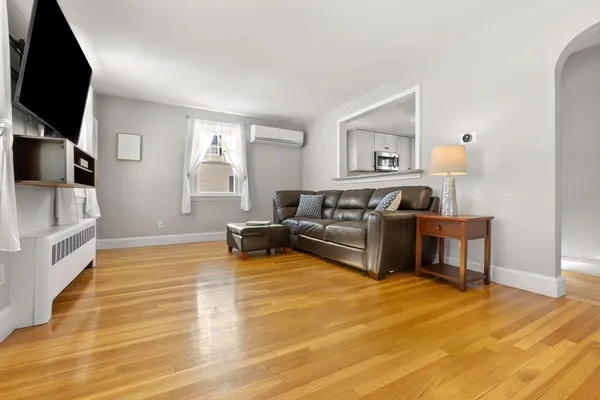 a living room with furniture and a flat screen tv