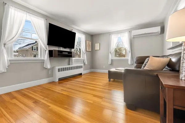 a bedroom with furniture and a flat screen tv