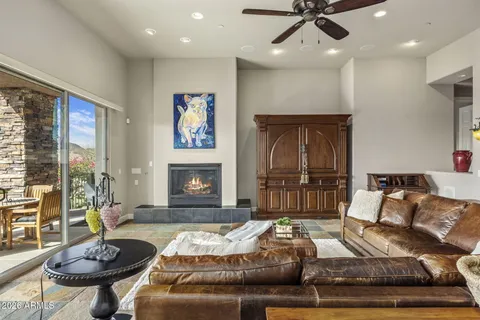a living room with furniture and kitchen view