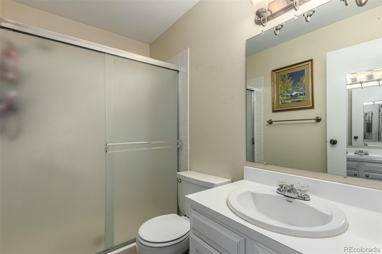 3657 South Laredo Street, Unit E Aurora, CO 80013 - Photo 11 of 20 a bathroom with a sink toilet and vanity