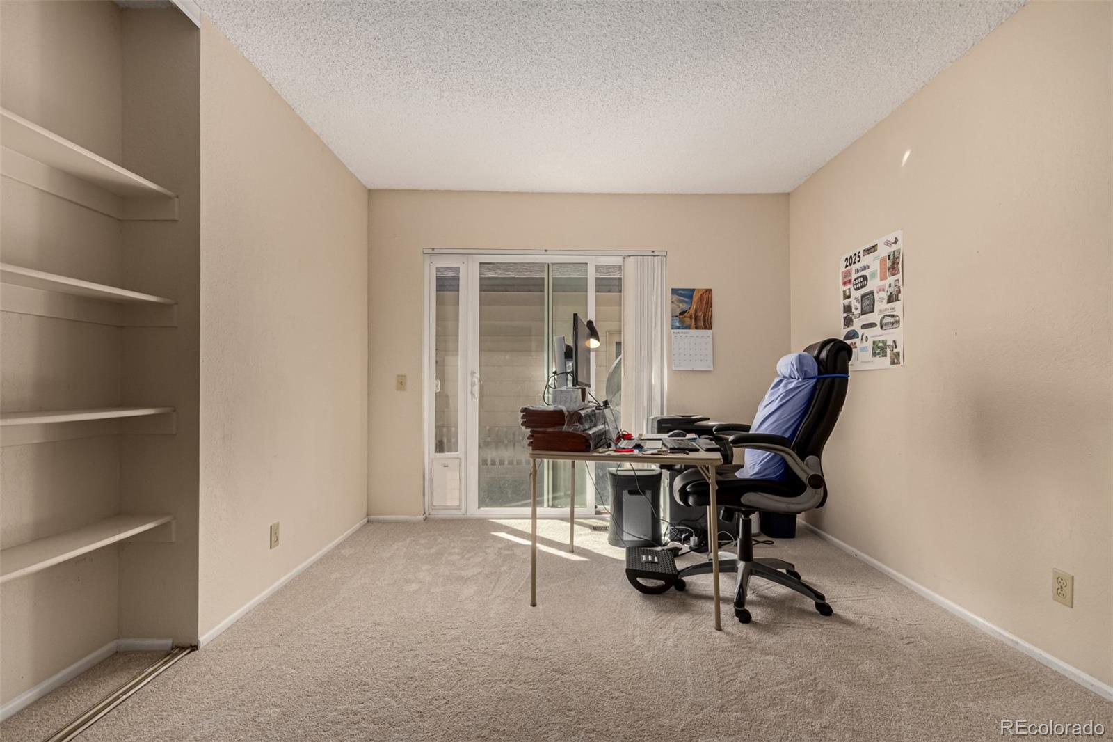 3657 South Laredo Street, Unit E Aurora, CO 80013 - Photo 12 of 20 a view of a workspace with furniture and a window