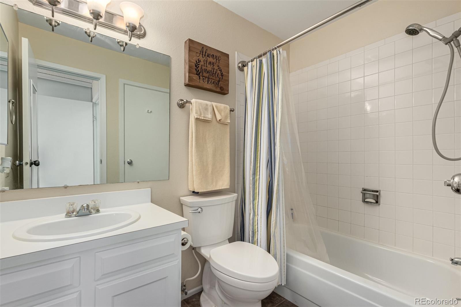 3657 South Laredo Street, Unit E Aurora, CO 80013 - Photo 13 of 20 a bathroom with a sink a toilet and shower