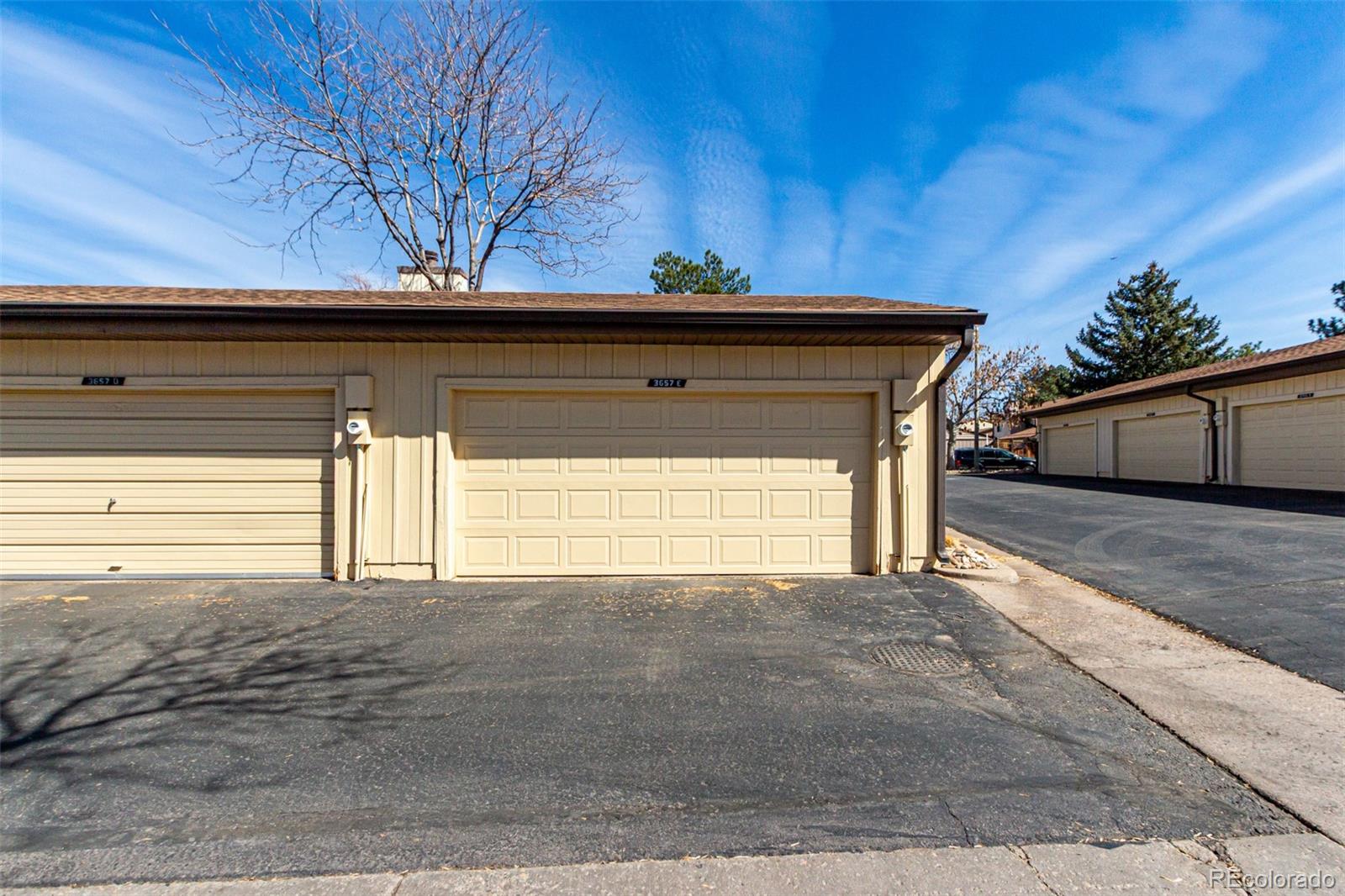 3657 South Laredo Street, Unit E Aurora, CO 80013 - Photo 16 of 20 a view of a house with a small yard