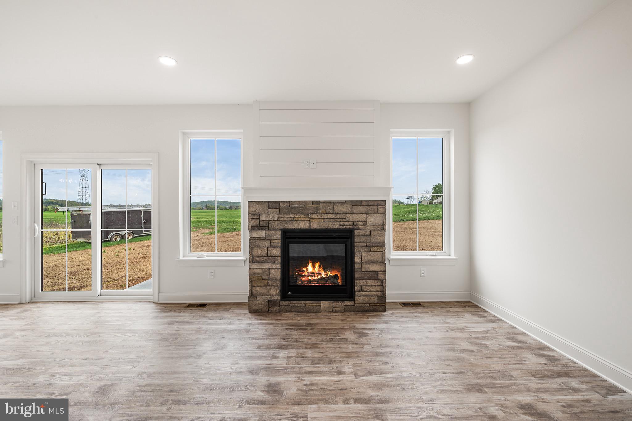 27 Lausch Road Denver, PA 17517 - Photo 15 of 43 a living room with a fireplace