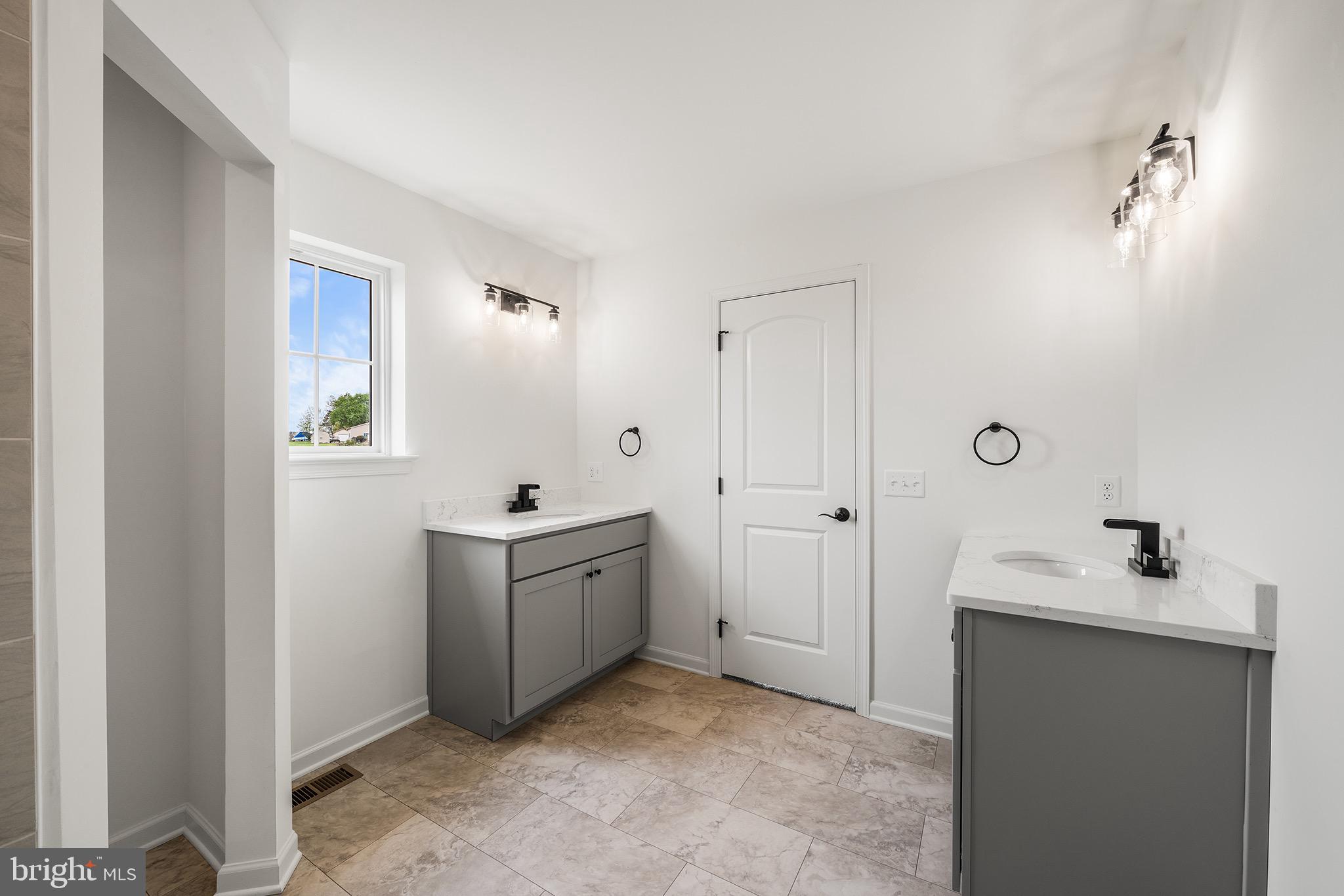 27 Lausch Road Denver, PA 17517 - Photo 29 of 43 a bathroom with a bathtub sink and mirror