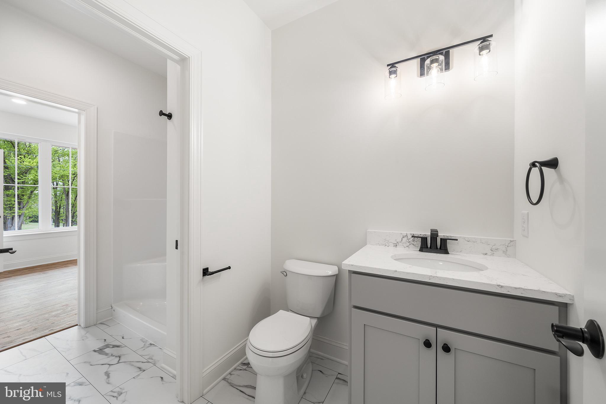 27 Lausch Road Denver, PA 17517 - Photo 7 of 43 a bathroom with a sink toilet and vanity