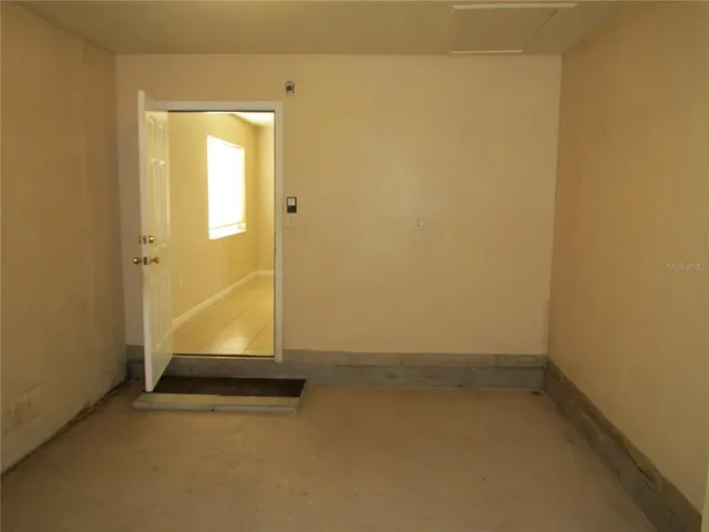 a kitchen with cabinets and white countertops