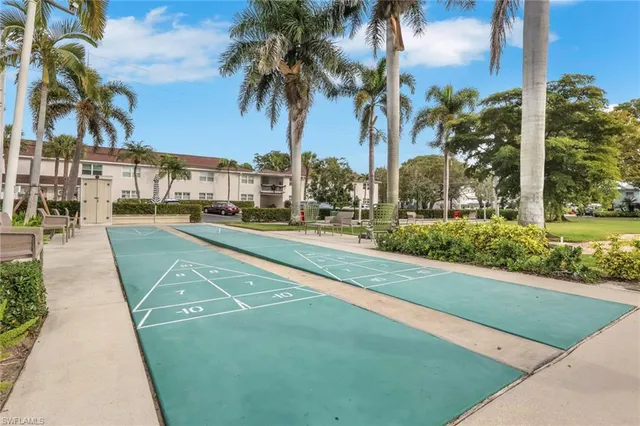 a view of a yard and cars park