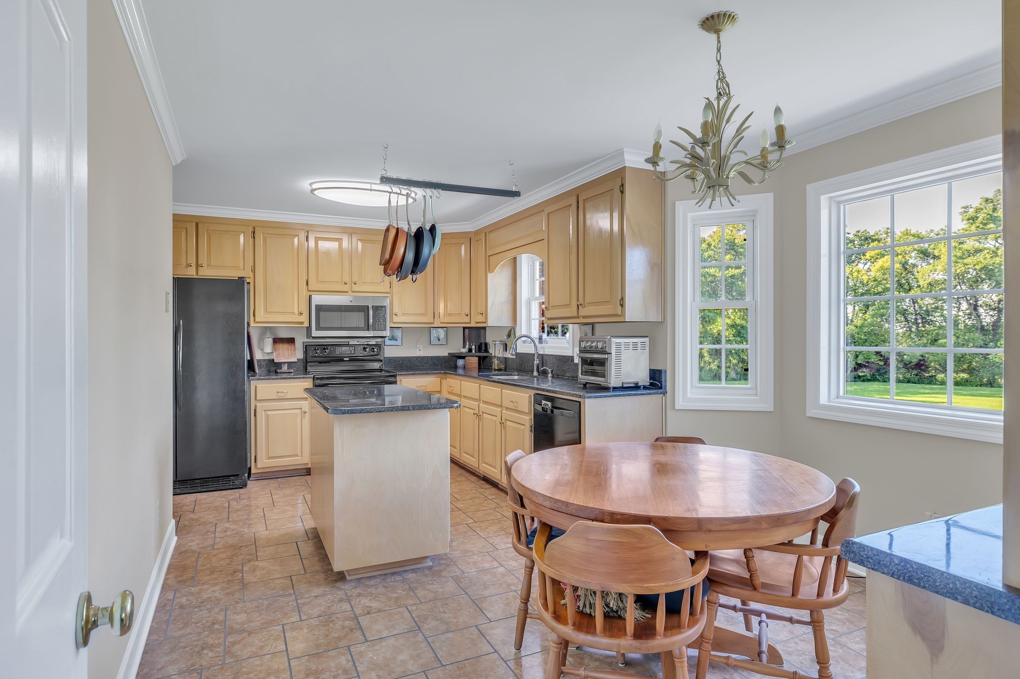 207 Sugar Tree Lane Pulaski, TN 38478 - Photo 16 of 30 a kitchen with a table and chairs in it