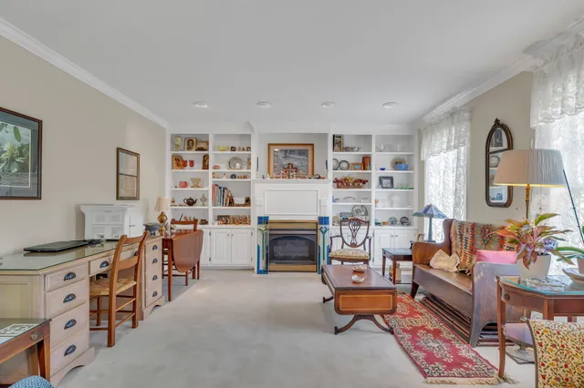 a bedroom with furniture and a fireplace