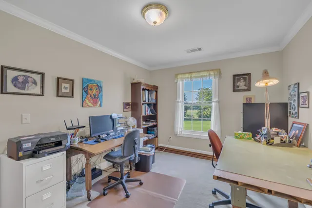 a workspace with furniture and a window