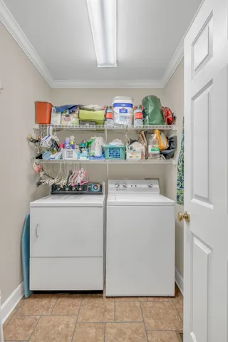 a view of storage and utility room with washer and dryer