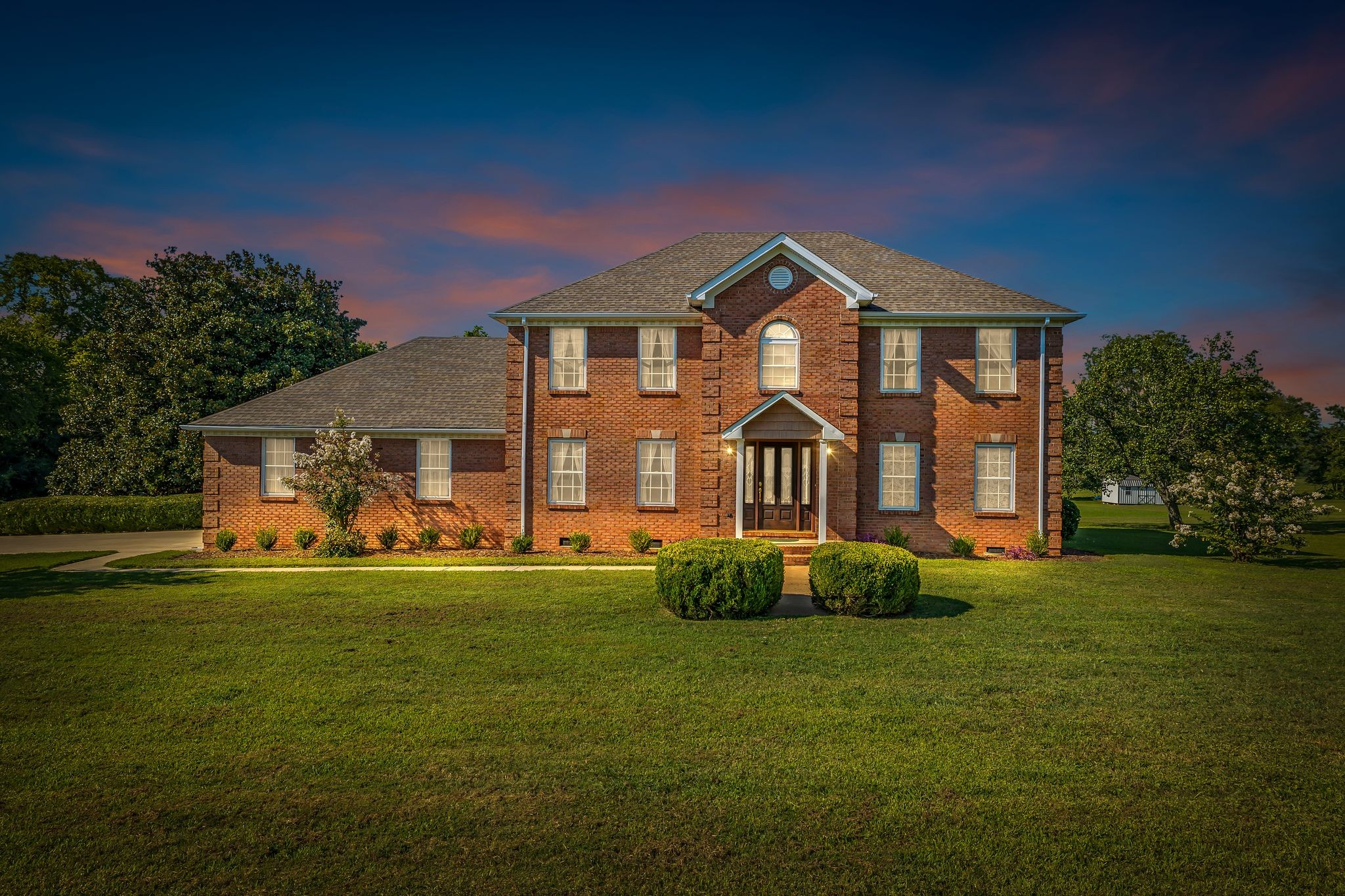 207 Sugar Tree Lane Pulaski, TN 38478 - Photo 6 of 30 a front view of a house with a garden