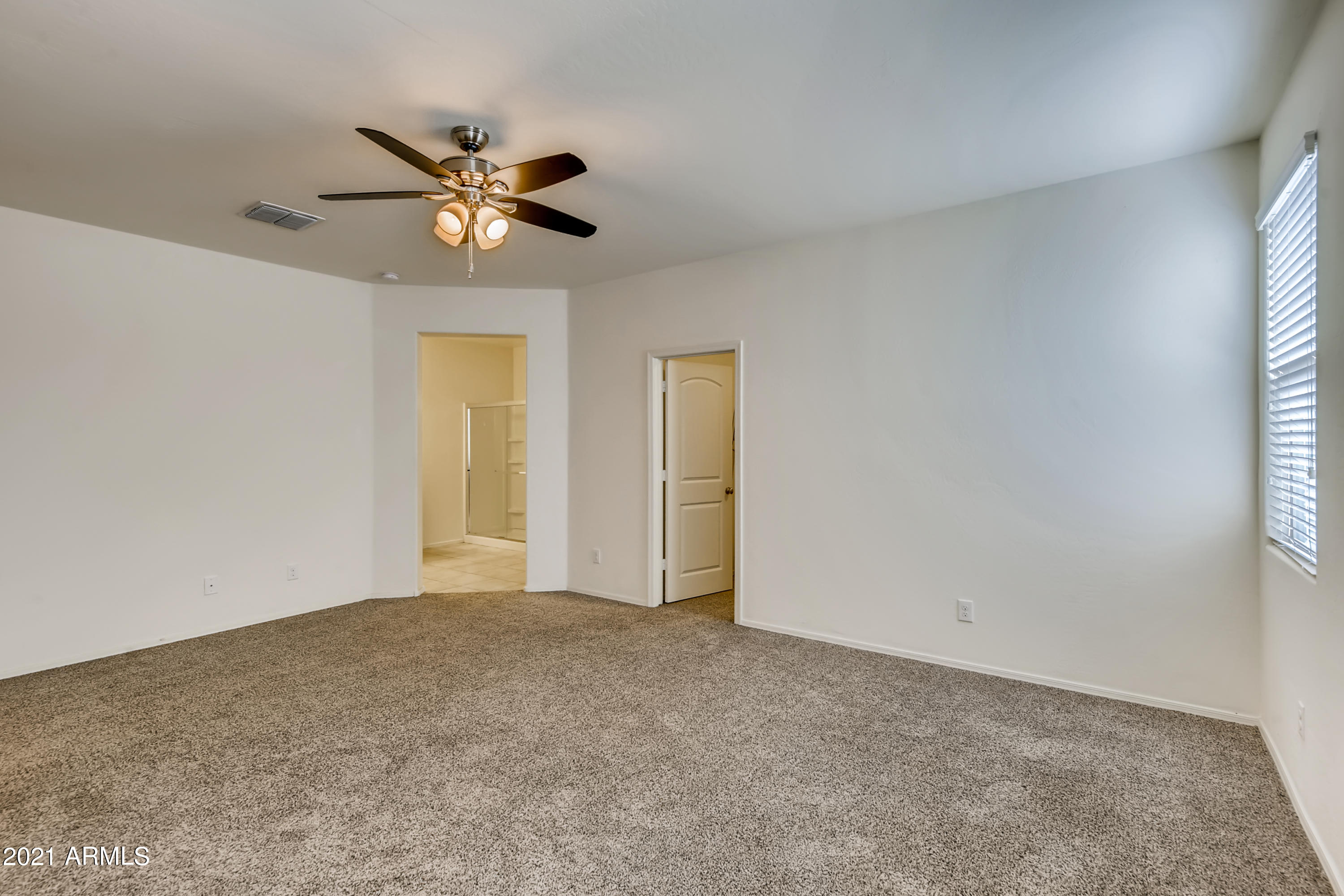 23807 West Chipman Road Buckeye, AZ 85326 - Photo 14 of 33 14-932082892-16 Primary Bedroom