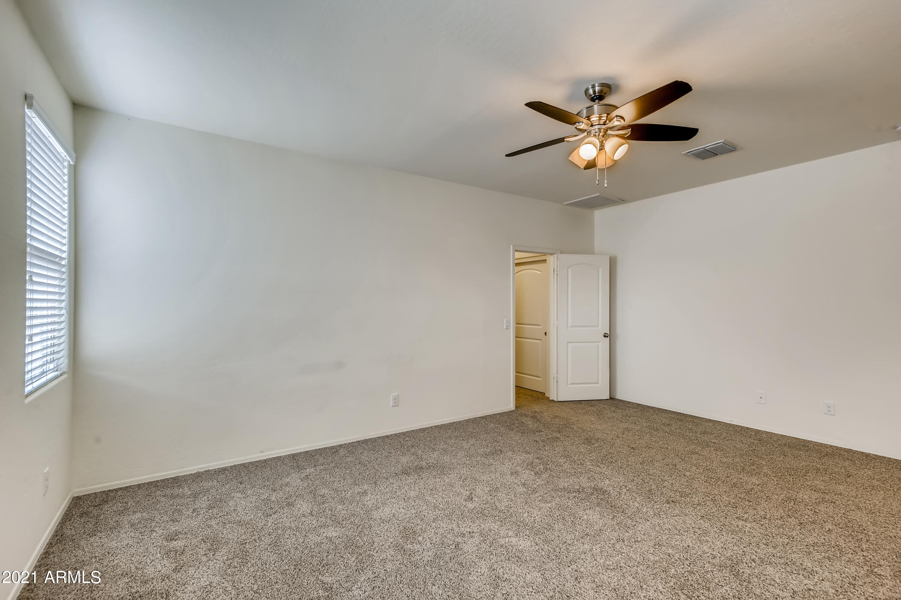 23807 West Chipman Road Buckeye, AZ 85326 - Photo 15 of 33 15-971707031-17 Primary Bedroom
