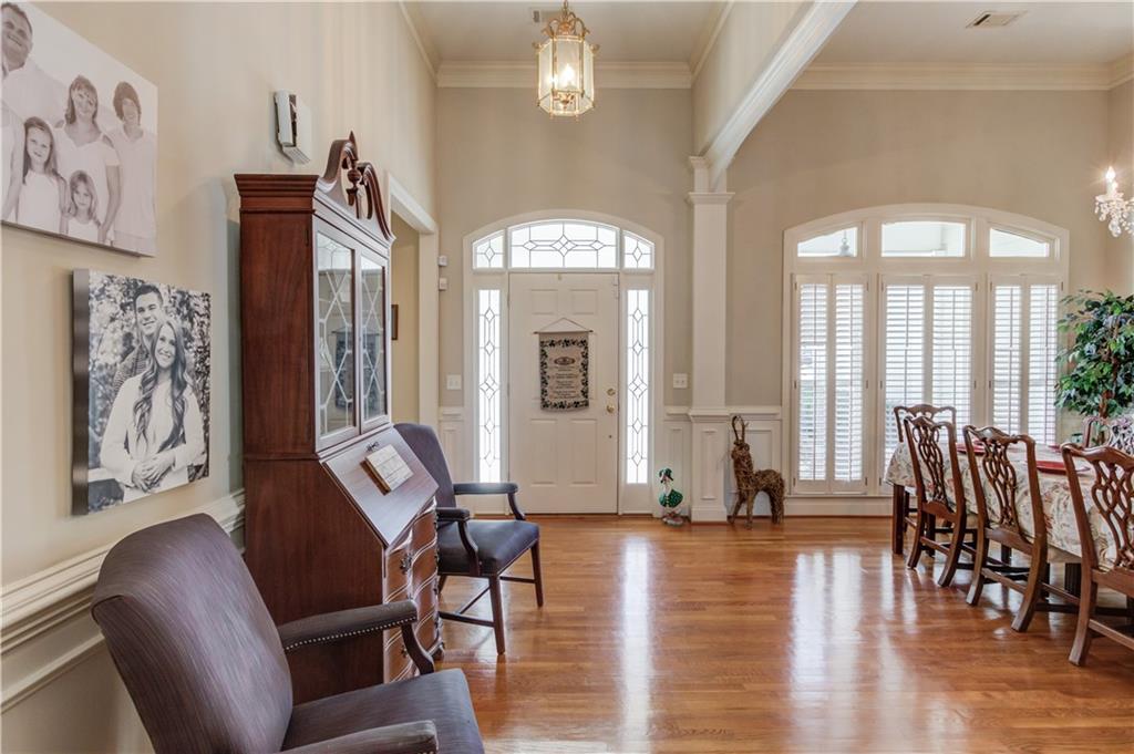 8012 Cypress Point Monroe, GA 30656 - Photo 11 of 67 a view of a livingroom with furniture wooden floor and windows