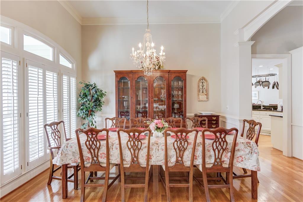 8012 Cypress Point Monroe, GA 30656 - Photo 12 of 67 a view of a dining room with furniture window and wooden floor