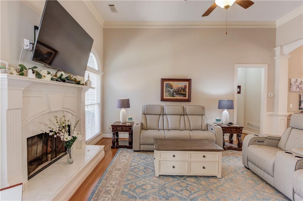 8012 Cypress Point Monroe, GA 30656 - Photo 15 of 67 a living room with furniture and a fireplace