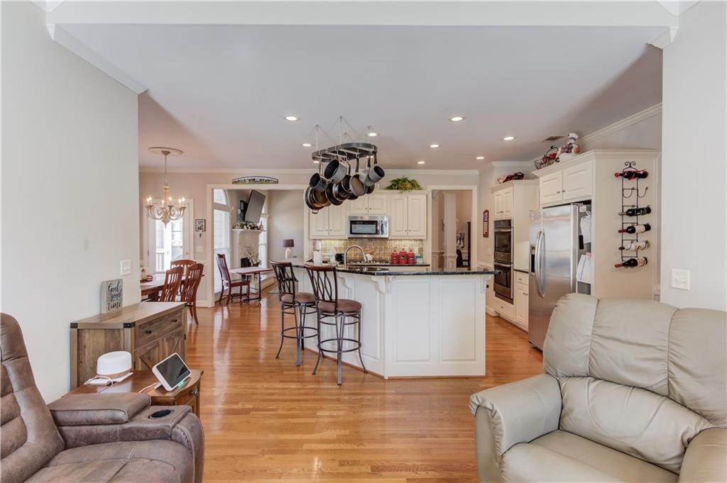 8012 Cypress Point Monroe, GA 30656 - Photo 22 of 67 a living room with furniture and kitchen view