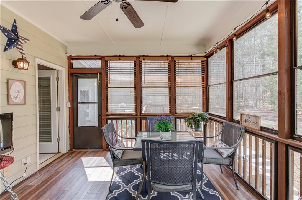 8012 Cypress Point Monroe, GA 30656 - Photo 25 of 67 a dining room with furniture water view and wooden floor