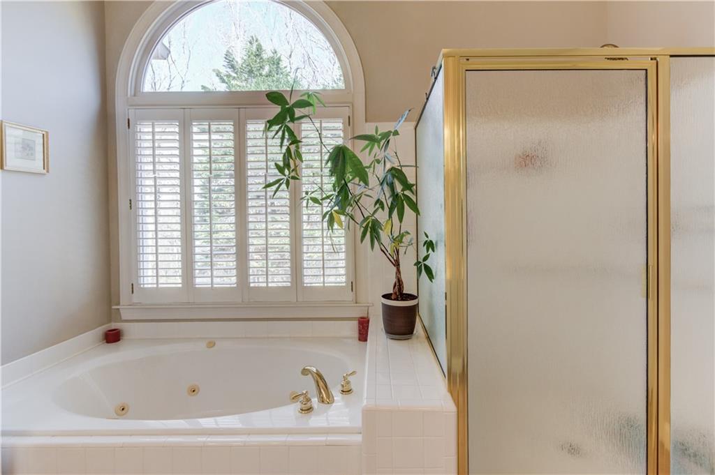 8012 Cypress Point Monroe, GA 30656 - Photo 29 of 67 a white bath tub sitting next to a window