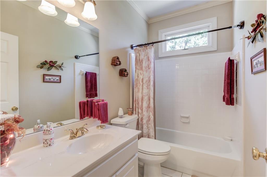 8012 Cypress Point Monroe, GA 30656 - Photo 32 of 67 a bathroom with a sink toilet and shower